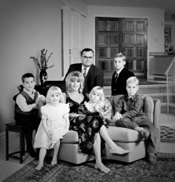 Formal in home Family Portrait of couple with five young childre