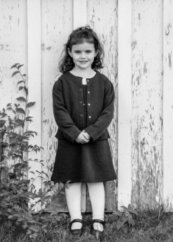 Black & White Outdoor Portrait of young girl wearing a sweater &