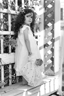 Black & White Outdoor Portrait of young girl wearing a white lac