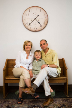 In home Family Portrait of mother, father and young boy sitting