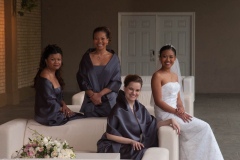 Group portrait of Bride, Maid of Honour and Bride's Maids sittin